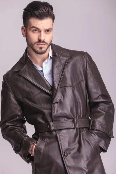 Handsome young business man wearing a brown leather coat — Zdjęcie stockowe