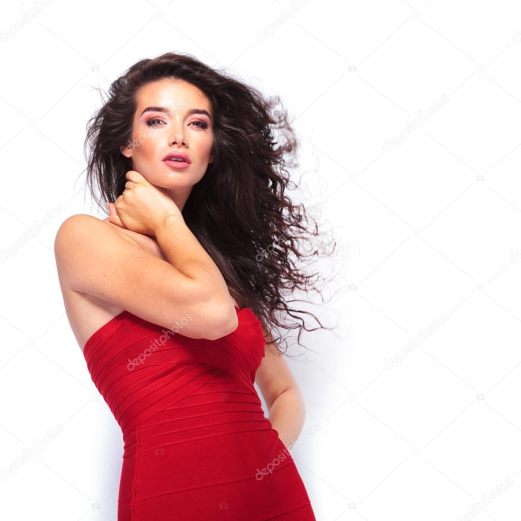 Sexy young lady posing on studio background