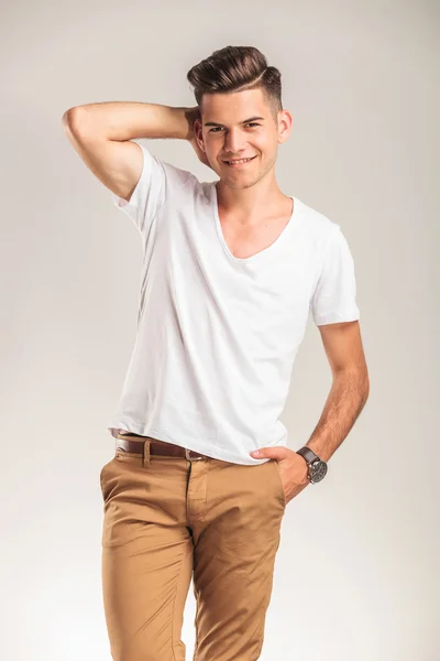 Young smiling boy with his hand in pocket — Stock Photo, Image