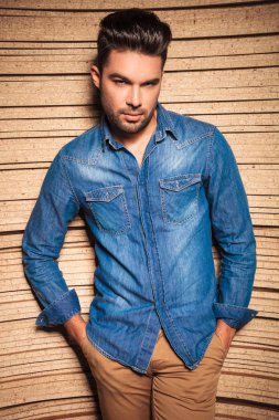 man looking at the camera with both hands in pockets