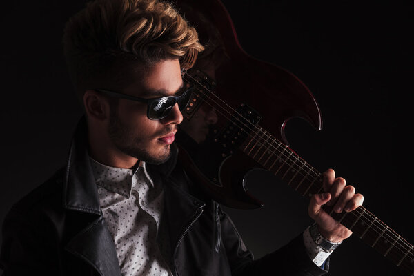 closeup portrait of a young guitarist