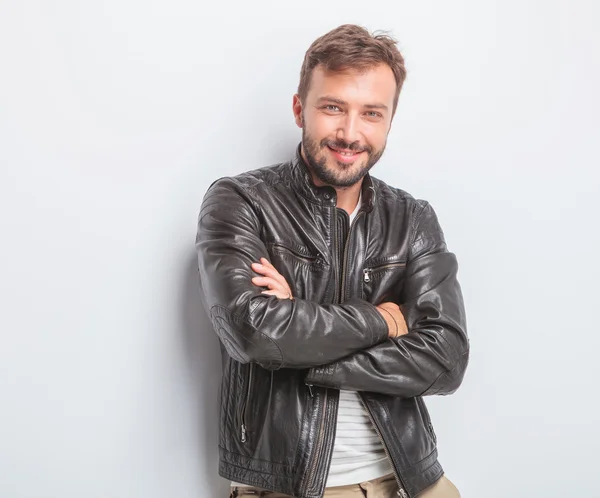 Confident young sexy man in leather jacket — Stock Photo, Image