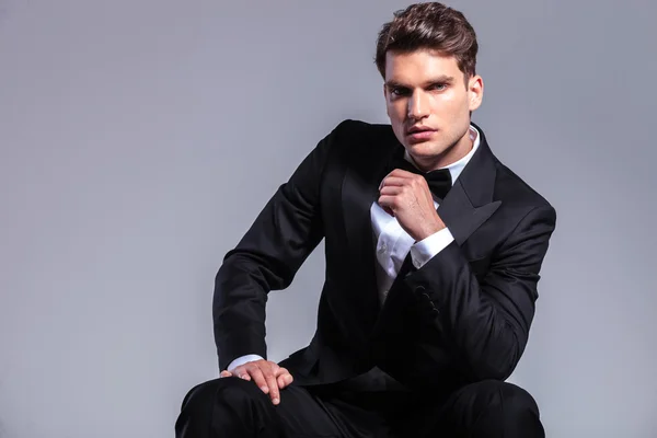 Front view of a young handsome business man sitting — Stock Photo, Image