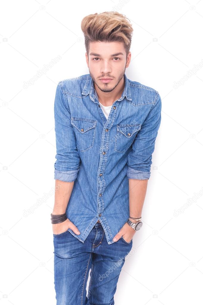 man pushing hands in pockets with shoulders up