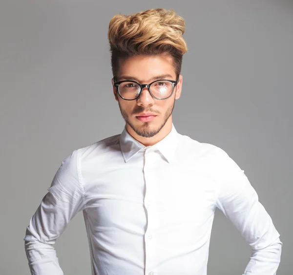 Smart young man wearing glasses while posing — Stock Photo, Image