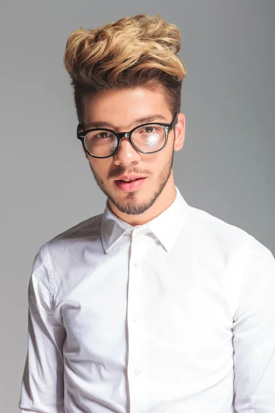 Handsome student wearing frames while posing in studio — Stock Photo, Image