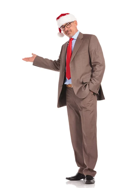 Full body picture of an old santa claus businessman presenting — Stock Photo, Image