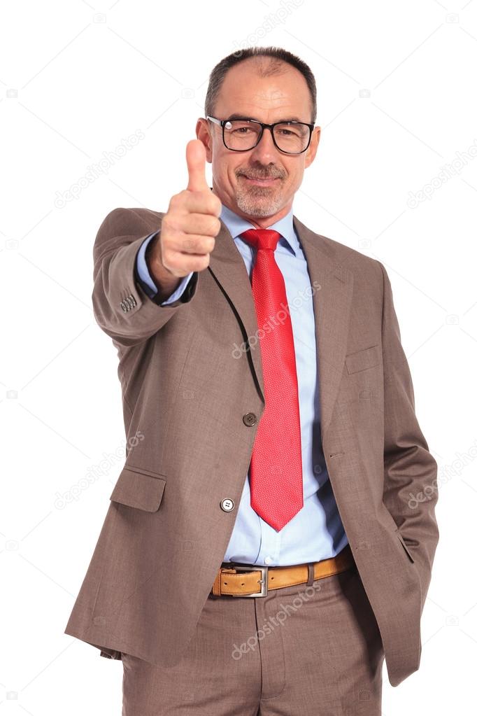 smiling old businessman making the ok thumbs up hand sign