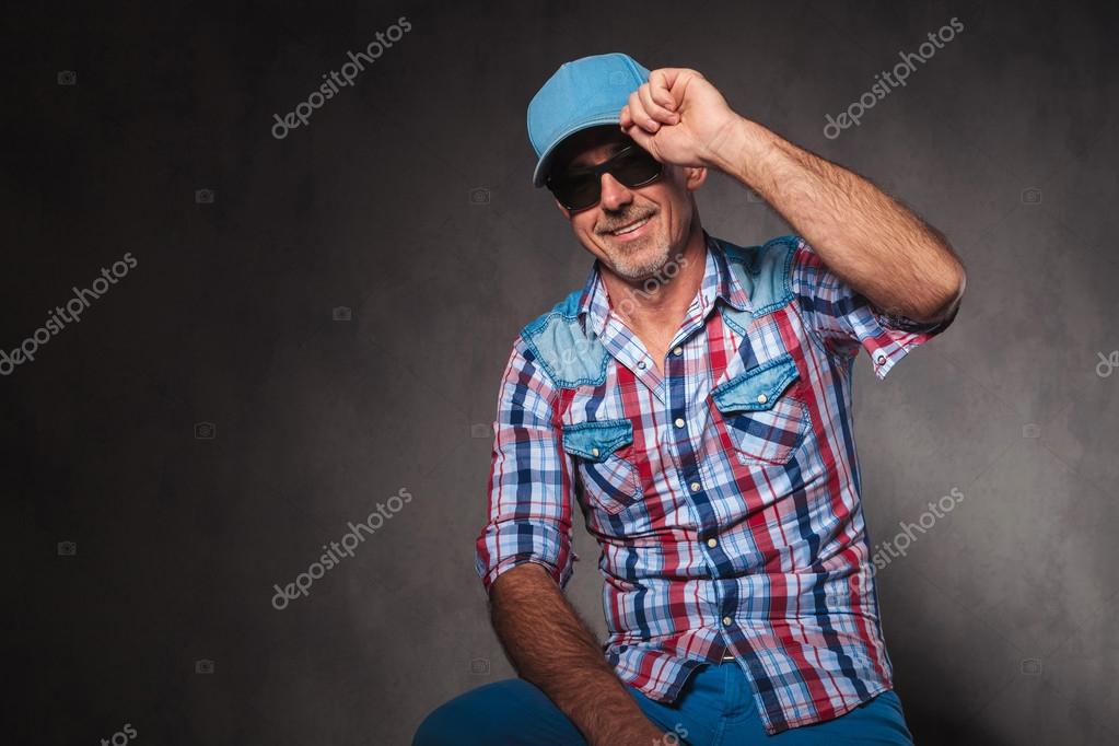 Young woman hip-hop dancer posing with a baseball cap in an abandoned  building Stock Photo - Alamy