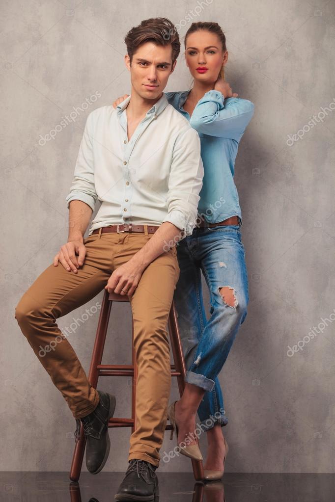 Young beautiful couple posing on couch at home Stock Photo by ©Milkos  381519074