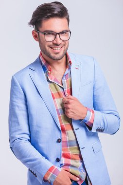 attractive businessman posing with hand in pocket