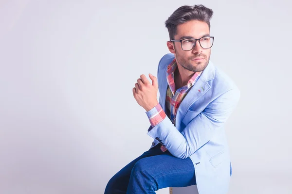 Portrait of smart casual man wearing glasses, seated — Stockfoto