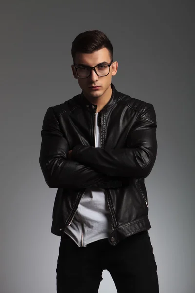 Portrait of stylish young man in black wearing glasses — Stockfoto