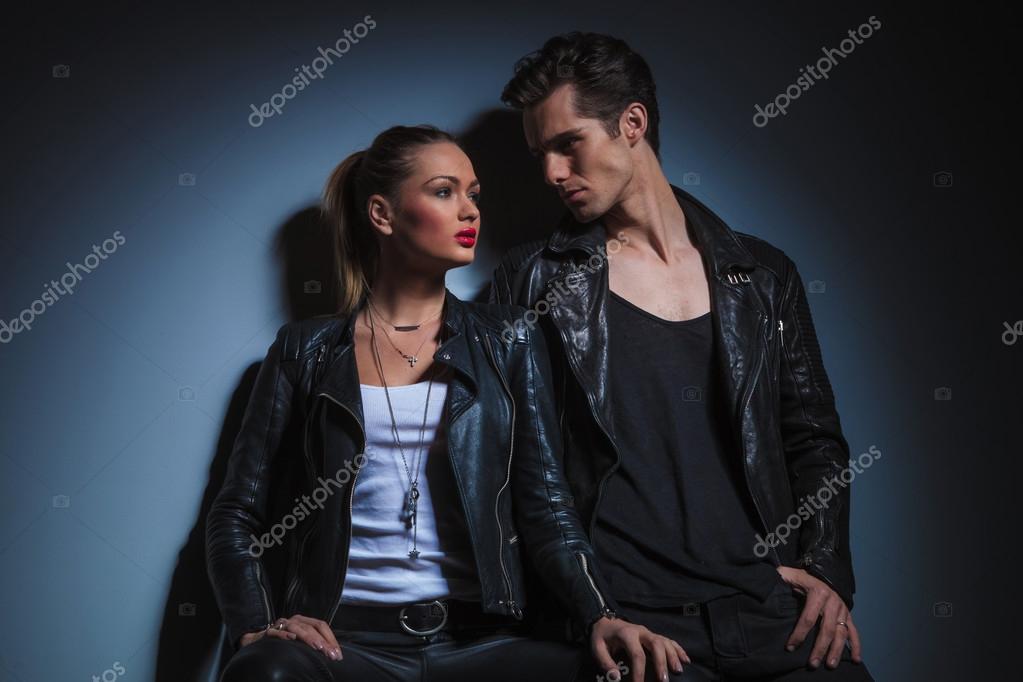 Man Lean On The Wall Looking At Woman While She Pose Man Lean On The Wall Looking At Woman While She Pose Stock Photo