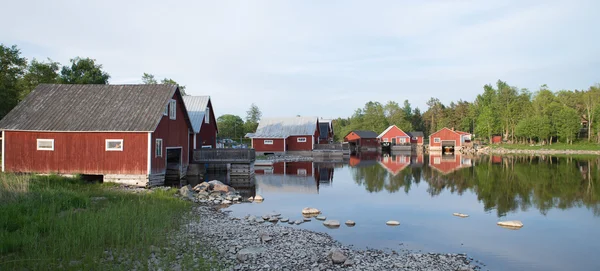 Fiskare stugor i solnedgången — Stockfoto