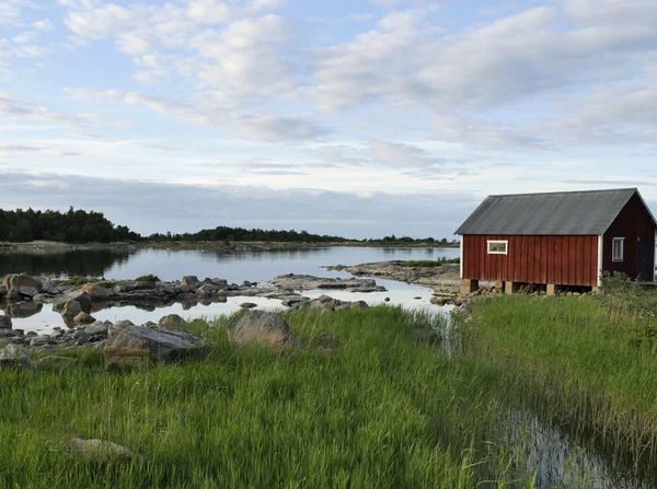 Fiskare stugor i solnedgången — Stockfoto