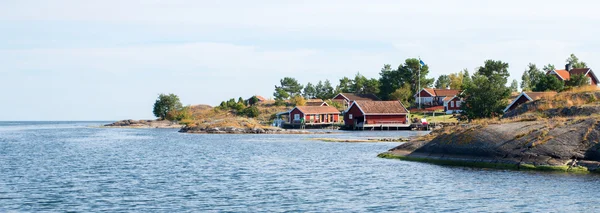 Seaside röda stugor — Stockfoto