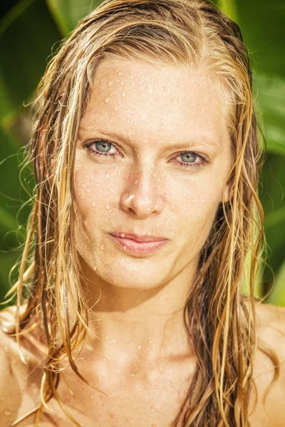 Woman in tropical shower — Stock Photo, Image