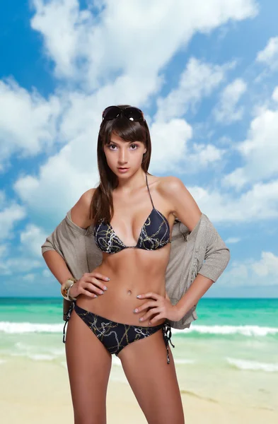 Woman in swimsuit relaxing at the beach Stock Image