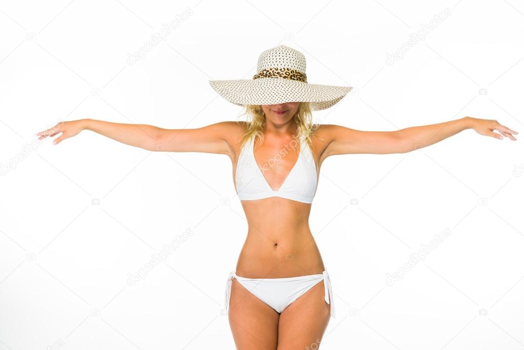 Woman posing in a white bikini over white 