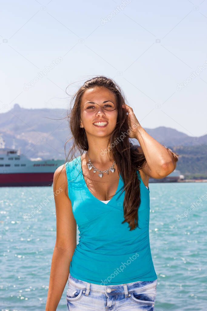 Young woman by the sea in Zakynthos Zante Greece