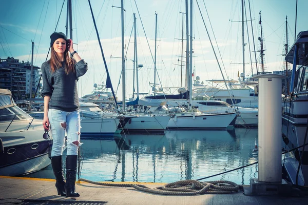 Young woman at the harbor — Stock Photo, Image