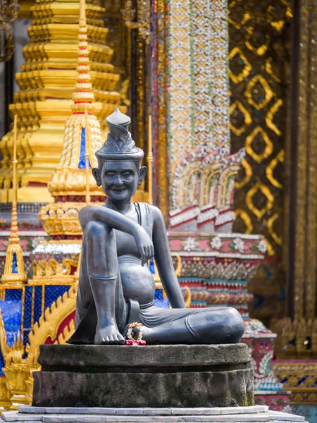 sitting figure on a stone capital in the Grand Palace, Bangkok