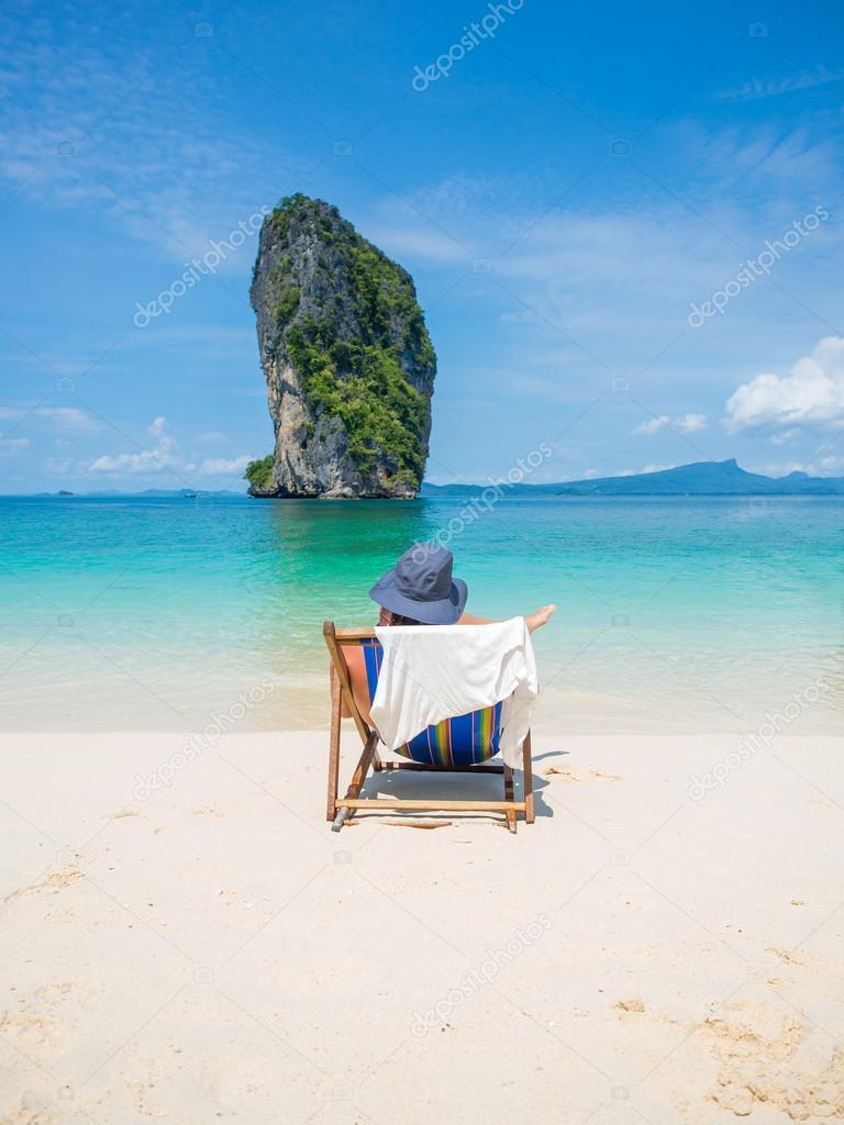 Man relaxing on the beach in Thailand