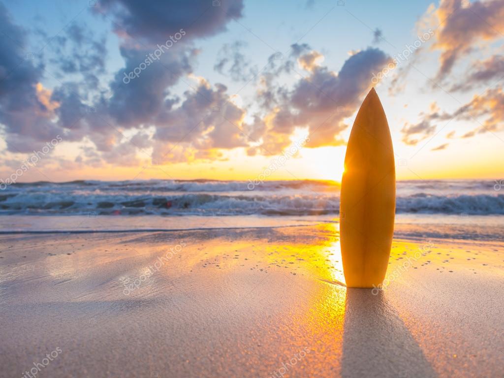 Surfboard On The Beach At Sunset Stock Photo By ©netfalls 61296759