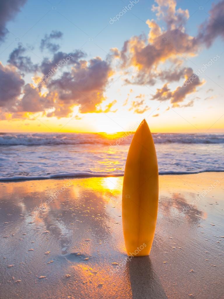 Surfboard on the beach at sunset Stock Photo by netfalls 61296777