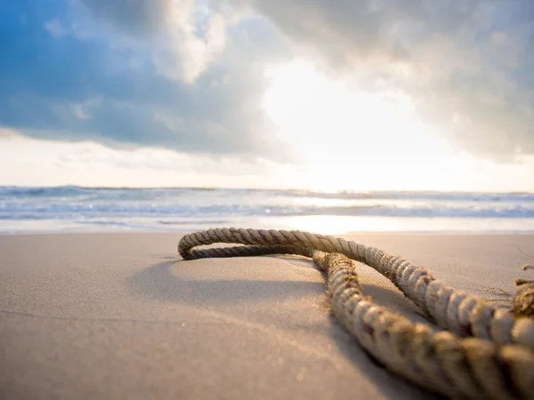 Old rope on the beach — Stock Photo, Image