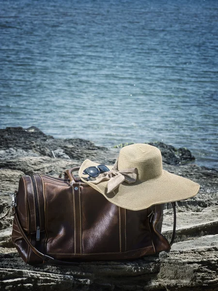 Leather travel bag on the beach — Stock Photo, Image