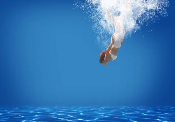 Young woman swimming underwater — Stock Photo, Image