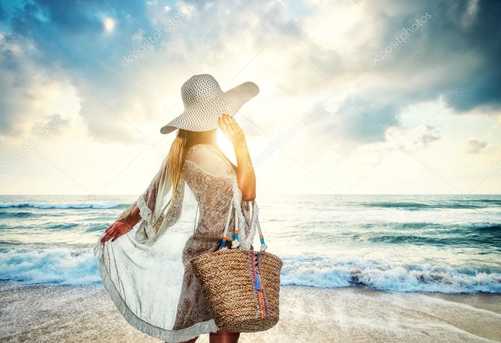 Classy young woman relaxing at the beach