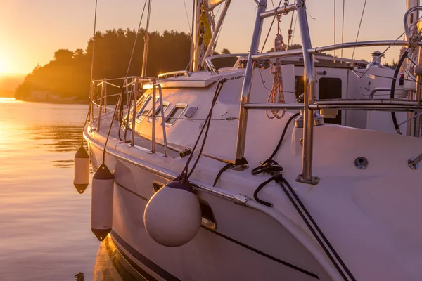 Sailing yacht at sunset — Stock Photo, Image