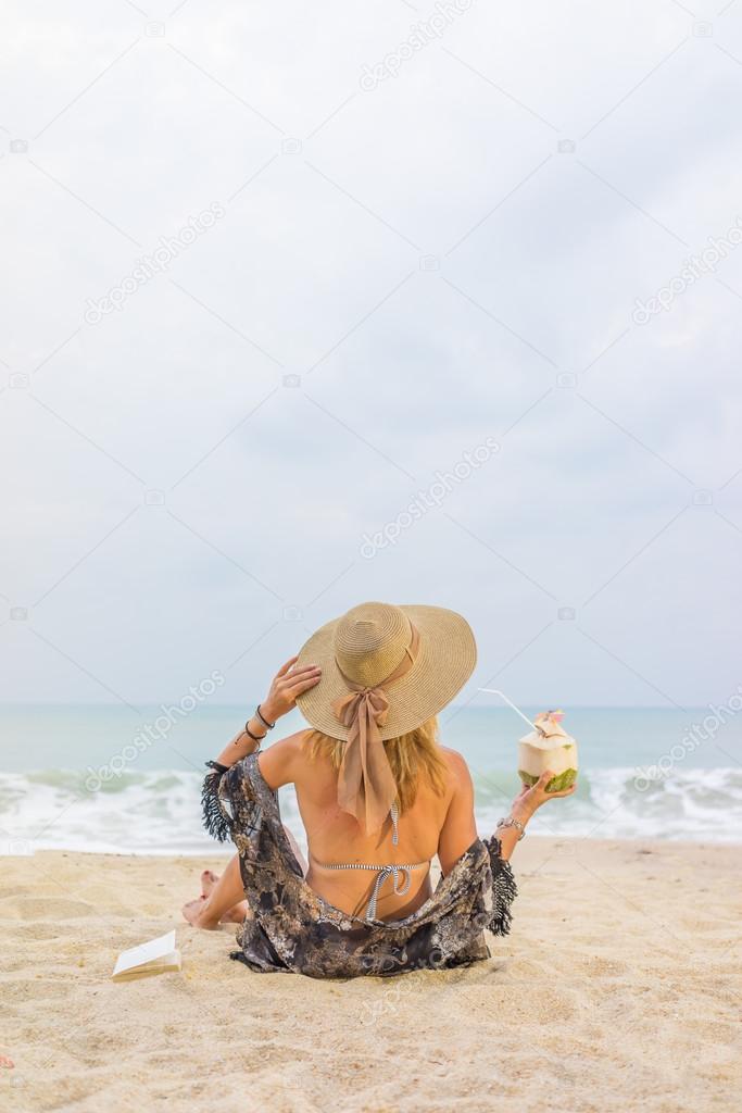 Classy woman on the beach