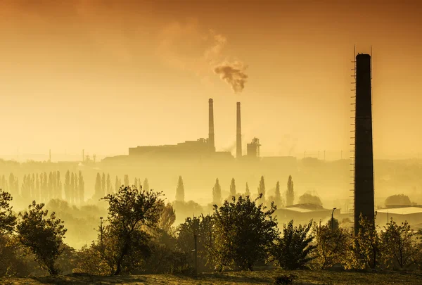 Power station with smoking chimney — Stock Photo, Image