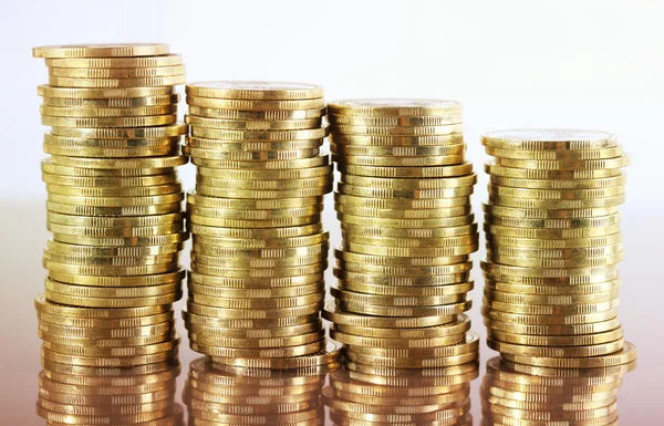 Four coin piles with reflection — Stock Photo, Image