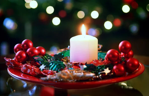 Burning candle on christmas wreath — Stock Photo, Image