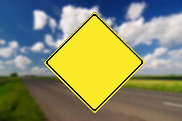 Empty road with yellow traffic sign — Stock Photo, Image