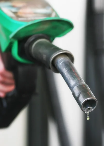 Drop of fuel drips from petrol pistol — Stock Photo, Image