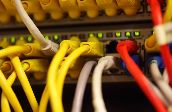 Modern network switch with cables — Stock Photo, Image