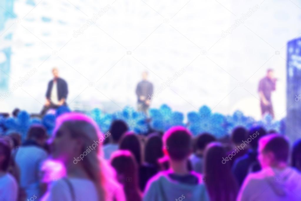 Blur background of people at the dj concert