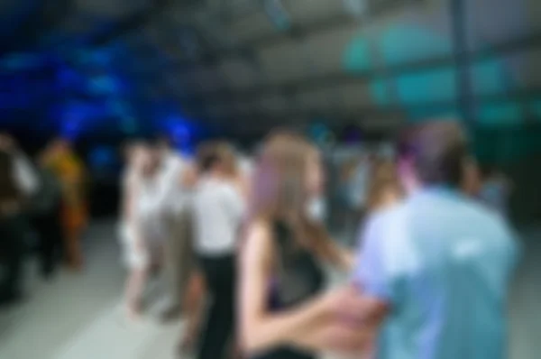 Mensen dansen wazig achtergrond — Stockfoto