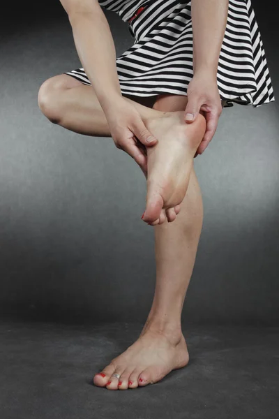 Woman massaging foot — Stock Photo, Image