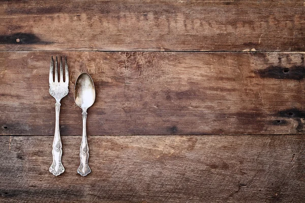 Antique Silverware over Rustic Wooden Background — Stock Photo, Image