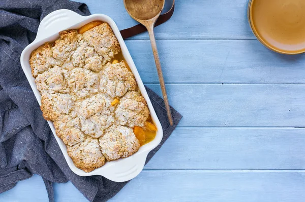 Freshly Baked Drop Biscuit Peach Cobbler Apron Wooden Spoon Shot — Stock Photo, Image