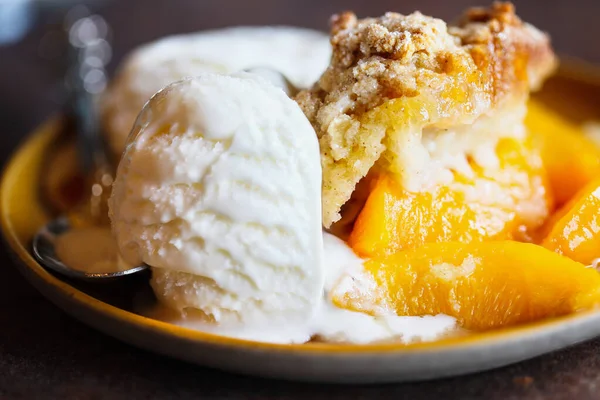 Abstract Freshly Baked Drop Biscuit Peach Cobbler Melting Ice Cream — Stock Photo, Image