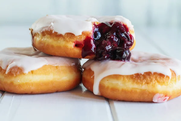 Frosted Vanilla Donuts Filled Blueberry Filling Selective Focus Blurred Foreground — Stock Photo, Image