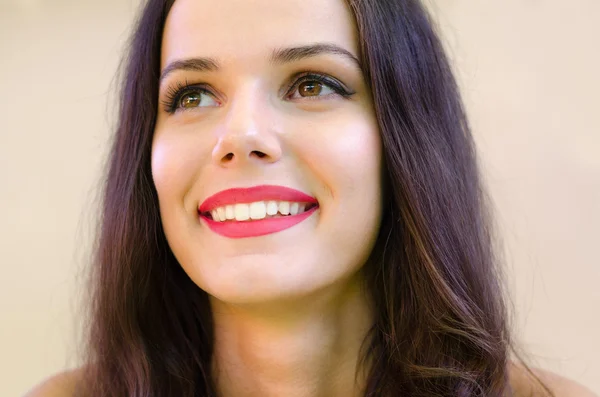 Portrait of beautiful smiling girl with long black hair — Stock Photo, Image